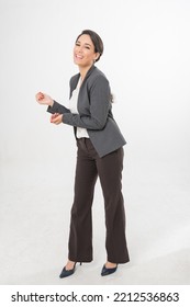 Studio Portrait Full Body Photo Of A Young Beautiful Elegant Brazilian Female Businesswoman Lady Wearing Smart Casual Business Attire Suit Posing With A Series Moments Of Emotion And Gesture