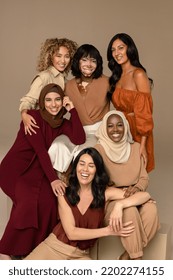 Studio Portrait Of A Group Of Beautiful Multiracial Women Smiling Together On A Neutral Background.