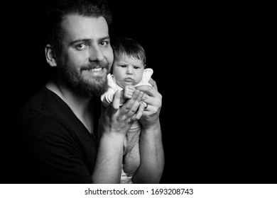 Muscular man holding baby Images, Stock Photos & Vectors | Shutterstock