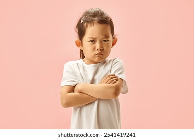 Studio portrait, Little Girl Expressed Sad, Displeased or Dissatisfied Crossing her Folded Arms Isolated on Pink Background. Offended kid portrait. Concept of negativity and children displeased.  - Powered by Shutterstock