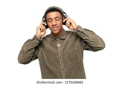 Studio Portrait Of Relaxed Cheerful Latin Man Wearing And Holding Wireless Headphones Isolated On White Wall, Enjoying Listening To Favourite Music Soundtrack, Wellbeing Concept