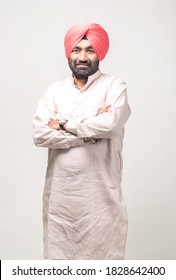 Studio Portrait Of A Sikh Handsome Man Looking At Camera With Smile