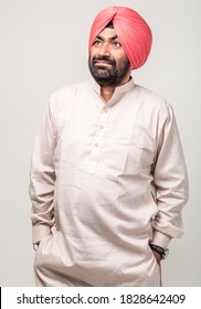 Studio Portrait Of A Sikh Handsome Man Looking At Camera With Smile