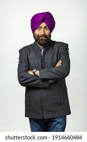 Studio Portrait Of A Sikh Handsome Man Looking At Camera With Smile