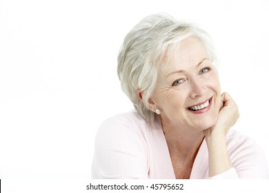 Studio Portrait Of Smiling Senior Woman