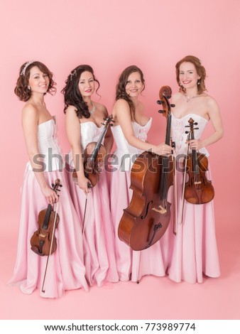 studio portrait of a string quartet in concert costumes