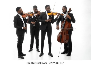 Studio portrait of a string quartet on a white background. African americans