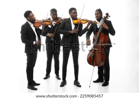 Studio portrait of a string quartet on a white background. African americans