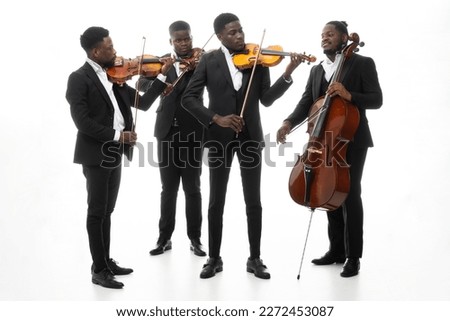 Studio portrait of a string quartet on a white background. African americans