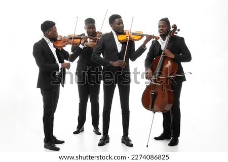 Studio portrait of a string quartet on a white background. African americans