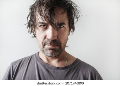 Studio portrait of an unshaven shaggy man. - Shutterstock ID 2071746890