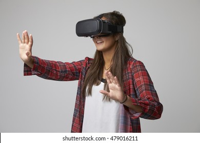 Studio Portrait Of Video Game Designer Wearing VR Headset