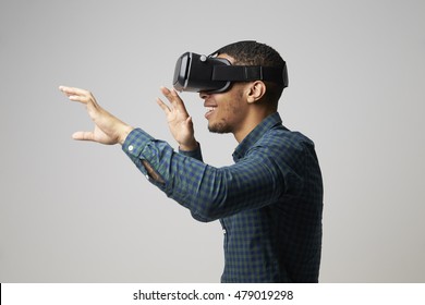 Studio Portrait Of Video Game Designer Wearing VR Headset