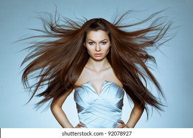 Studio Portrait Of Woman With Flying Hair