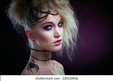 Studio Portrait Of Woman In Halloween Makeup, Black Background.