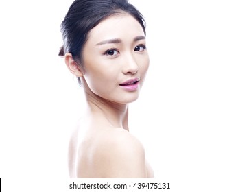 studio portrait of a young asian woman, isolated on white.