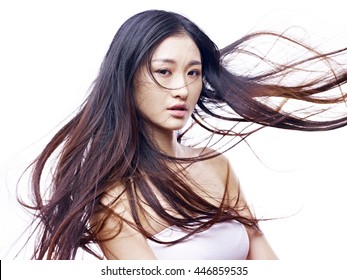 Studio Portrait Of A Young And Beautiful Asian Fashion Model, Isolated On White Background.