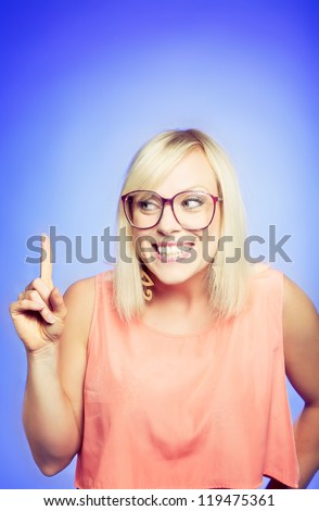 Studio portrait of a young female college student with a naughty idea