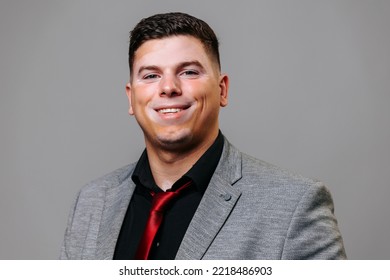 Studio Portrait Young Man With Vitiligo Of Unusual Appearance With A Joyful Expression On His Face. A Big Smile And Acceptance Of Yourself Is The Concept Of Happiness. Business Suit Successful Career.