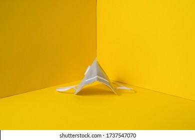 studio session of gray face protection masks, on yellow background