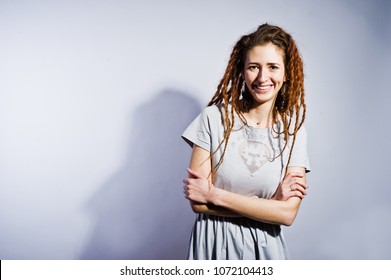 Studio Shoot Of Girl In Gray Dress With Dreads On White Background.