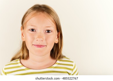 Studio Shot Of Adorable Little 9 Year Old Girl 