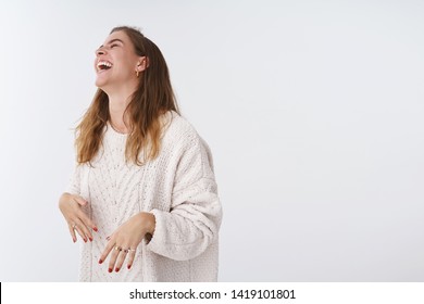 Studio shot amused happy attractive modern woman having fun laughing joking friendly company raising head chuckling lmao close eyes, belly muscles hurt giggling out loud, white background - Shutterstock ID 1419101801