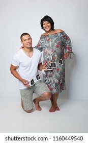 Studio Shot Of An Attractive Mixed Race Couple 