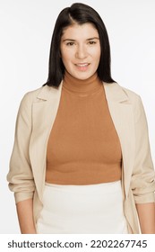 Studio Shot Of An Attractive Two Spirit Native American Person In Their 30's Smiling On A White Seamless.