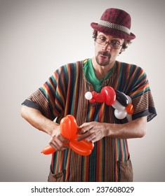 Studio Shot Of Balloon Twister With Penguins And Balloons.