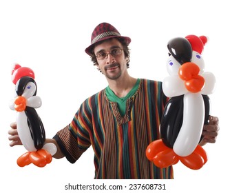 Studio Shot Of Balloon Twister With Penguins And Balloons Isolated On White.