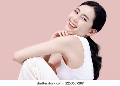 Studio shot of Beautiful young Asian woman with clean fresh skin on pink background, Face care, Facial treatment, Cosmetology, beauty and spa. - Shutterstock ID 2253689289