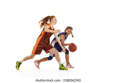 Studio shot of beginner basketball players, young girls, teen training with basketball ball isolated on white background. Concept of sport, team, enegry, competition, skills. Junior game. Copy space - Shutterstock ID 2180362345