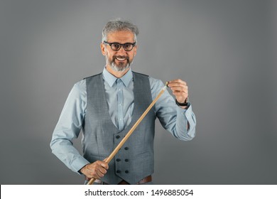 Studio Shot Of Billiard Player Holding Stick