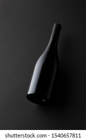 Studio Shot Of Blank Wine Bottle On Black Board