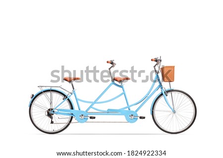 Studio shot of a blue tandem twin bicycle isolated on white background