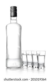 Studio Shot Of Bottle And Glasses Of Vodka Isolated On White