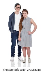 Studio shot of brother and sister posing on white background