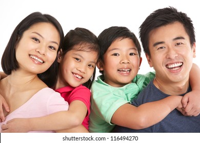 Studio Shot Of Chinese Family