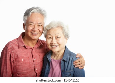 Studio Shot Of Chinese Senior Couple