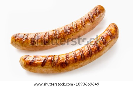 Studio shot close-up of two grilled German sausages on white background for copy space