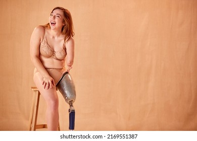 Studio Shot Of Confident Natural Woman With Prosthetic Limb In Underwear Promoting Body Positivity