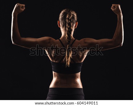 Similar – Image, Stock Photo Rear view portrait of one young middle age athletic woman at crossfit training, exercising with trx suspension fitness straps over dark background