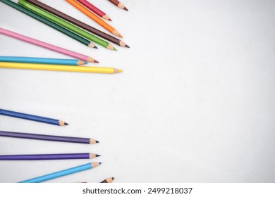 Studio shot of flatlay photo of kids coloring pencils on white background banner, copy space. Back to school concept. - Powered by Shutterstock