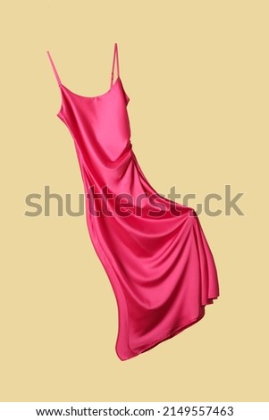 Studio shot of floating long silk camisole dress
