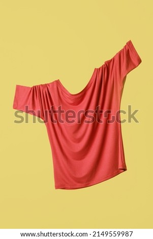 Studio shot of floating simple wide blouse