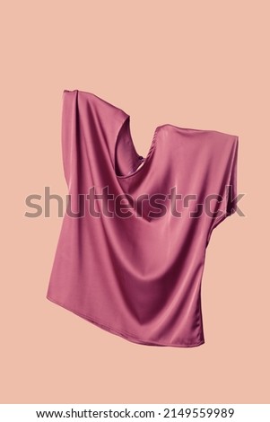 Studio shot of floating simple wide blouse