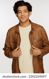 Studio Shot Of A Gorgeous Multiracial Man In His 20's Smiling On A White Seamless.