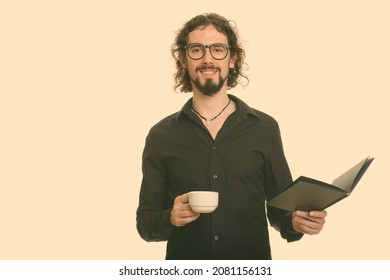 Studio shot of handsome bearded businessman with curly hair isolated against white background - Powered by Shutterstock