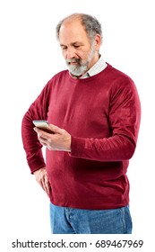 Studio Shot Of Handsome Senior Man Using Smart Phone With His Hand On Hip White Background